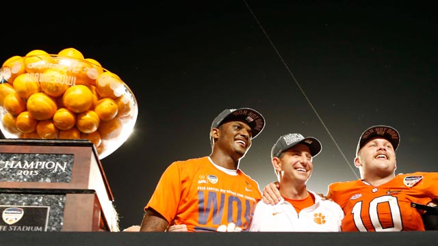 Clemson quarterback Deshaun Watson, left head coach Dabo Swinney and linebacker Ben Boulware pose with the Orange Bowl trophy. AP